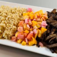 Hawaiian Entree · Grilled meat topped with mango salsa and served over brown. rice.