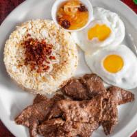 Tapsilog · Marinated beef, over easy egg, and fried rice.