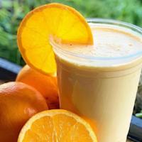 Orange Dream · Fresh squeezed orange juice, mango, orange zest, Greek yogurt and coconut milk.