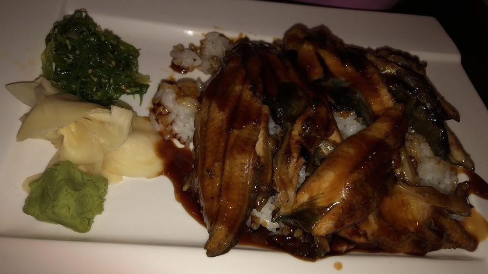 Unagi Don · A bowl of steamed rice topped with broiled japanese eel.