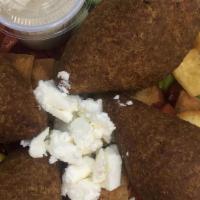 Kibbeh · Four pieces. Kibbeh is made of bulghur cracked wheat, minced onions and lean ground beef, la...