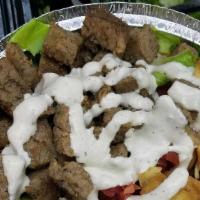 Lamb · Comes with rice salad and white sauce.