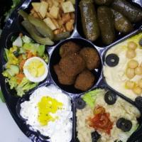 Falafel Platter · Vegetarian. Comes with rice and salad. Five pieces small, six pieces large.