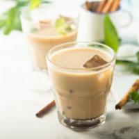 Iced Chai Latte · Aromatic, spiced chai tea with milk over ice.
