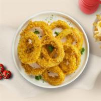 Crispy Rings · Sliced onions dipped in a light batter and fried until crispy and golden brown. Served with ...