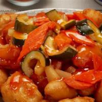 Sweet & Sour Chicken · Breaded chicken with pineapples, cucumber and carrots with sweet and sour sauce.