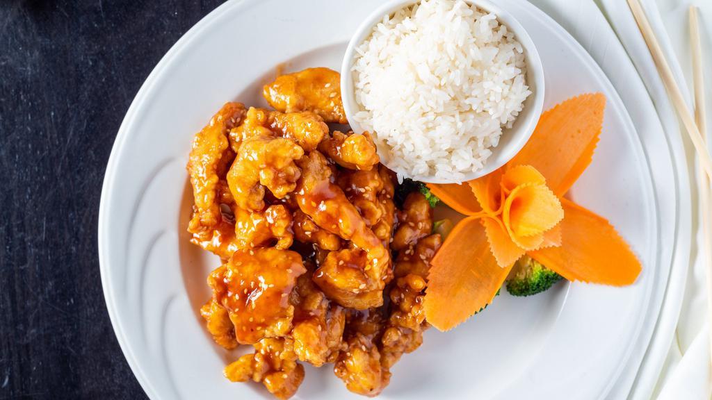 Sesame Chicken · Breaded chicken sautéed in a sweet brown sauce topped with sesame seeds.