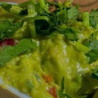 Curbside Guacamole And Chips 4Oz · Fresh made guacamole served with warm handcut tortilla chips