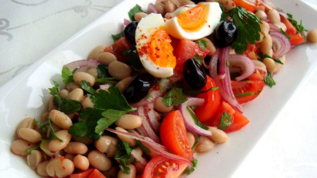 Mixed Beans Salad · Chickpeas, red kidney beans, black beans with onion, tomato, parsley, olive oil, and vinegar.