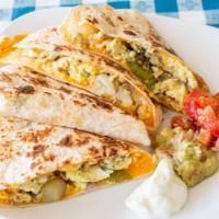 Breakfast Quesadilla · 3 Eggs Scrambled, Peppers, Onions, Cheddar Cheese and Home Fried Potatoes served on a large ...