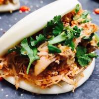 Red Curry Chicken Bao · Red curry chicken, carrot, red onion, cilantro, crispy shallots, and special green sauce. Mi...