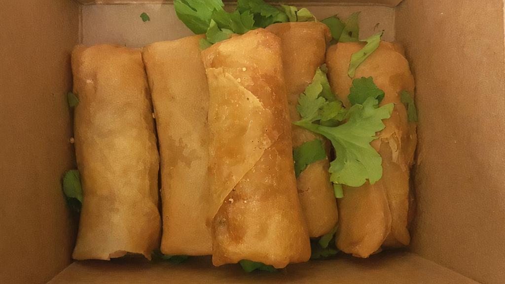 Veggie Spring Rolls · Vermicelli, cabbage, carrot and sweet chili sauce. Topped with cilantro, red cabbage, and black sesame seeds. Vegetarian.