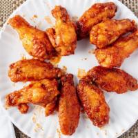 Buffalo Wings · Most popular. Twelve deep fried chicken wings prepared in a mild, medium, hot or barbeque sa...