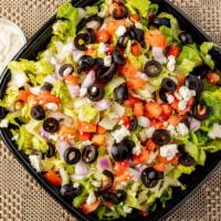 Greek Salad · Iceberg lettuce with chopped tomatoes, cucumbers, red onions topped with Feta cheese and gre...