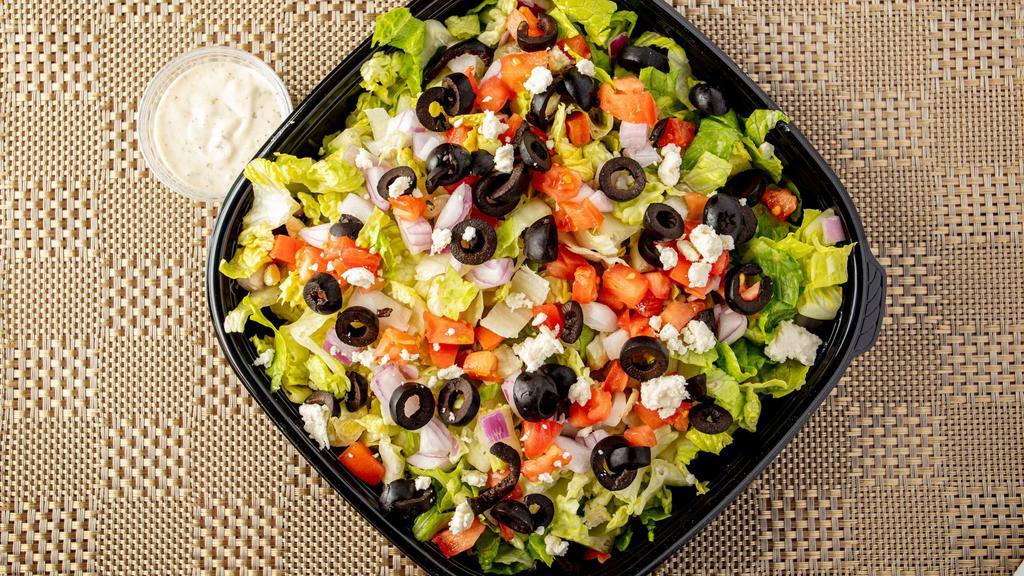 Greek Salad · Iceberg lettuce with chopped tomatoes, cucumbers, red onions topped with Feta cheese and green olives.