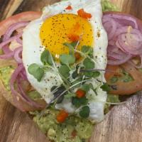 Guac Toast · Multigrain toast topped with fresh smashed avocado, red onions, Beefsteak tomatoes, topped w...