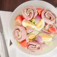 Chef Salad · Lettuce, tomato, onions, ham, turkey Swiss, roast beef and hard boiled eggs.