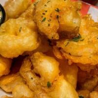 Popcorn Shrimp · Crispy rock shrimp served with remoulade sauce or spicy bbq.