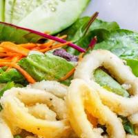 Calamari Salad · Spring mixed served with Crispy calamari ring, served with Naughty Crab’s Onion sauce.
