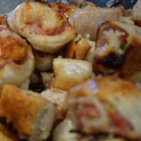 Boli Knots · Ham, capicola, and Mozzarella cheese, in garlic, and oil with spices. Served with a side of ...