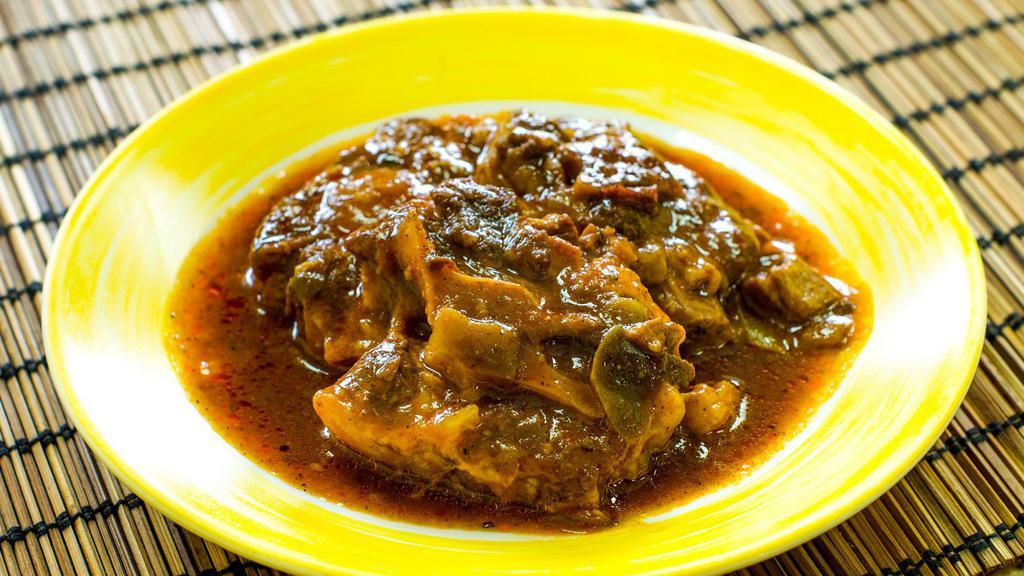 Rabo Encendido (Oxtail Stew) · Includes one rice choice and one side dish of your choice.