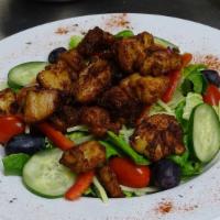 Chicken Salad · Hand seasoned chicken breast strips, crispy mixed greens cherry tomatoes, onions, dried cran...