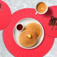 Classic Pancakes · Fluffy pancakes cooked with care and love served with butter and maple syrup. Served in pairs.