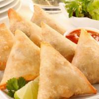 Meat Samosa (Chicken) · 3 pec Triangular, deep fried savory pastry stuffed with chicken and spices. Served with tama...