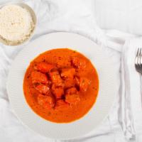 Chicken Tikka Masala · Boneless pieces of chicken marinated in traditional spices, tomatoes and yogurt.