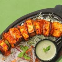 Paneer Tikka (06 Pcs) · Paneer cooked in Tandoori with sour cream, cream cheese which comes with Rice.