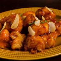 Lasuni Gobi · Deep fried battered cauliflower sauteed in a tangy garlic sauce with onions and bell peppers