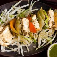 Paneer Taash Kebab · Tandoor style smoked paneer cheese with onions and bell peppers in a creamy peppercorn marin...