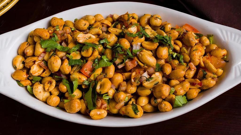 Peanut Chili Masala · Roasted peanuts tossed with a blend of tempered Indian spices, green chilies and onions