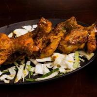 Tangri Kebab · Skewered chicken drumsticks in a creamy marinade, cooked to perfection in a traditional tand...