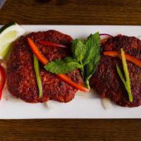Chapli Kebab · Tender lamb patties spiced with a blend of coriander and green chilies