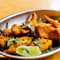 Fish Amritsari · Deep fried fish in a batter spiced with a blend of Ajwain and other Indian spices