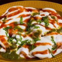 Purani Delhi Ki Papri Chaat · Crunchy papri with spiced potatoes and yogurt, served cold with mint and tamarind chutnies