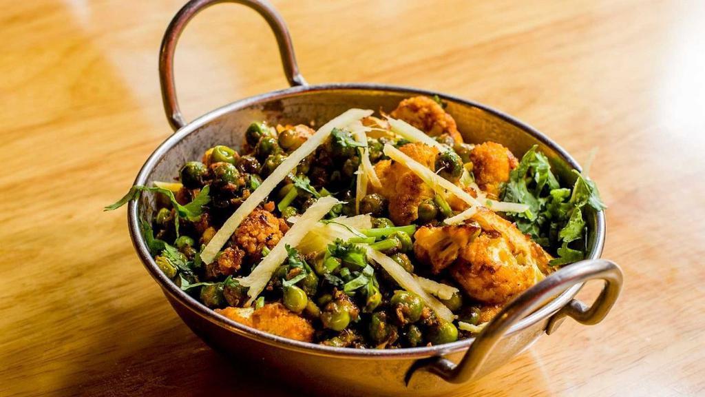Bhuni Gobi Mattar · Well spiced cauliflower and green peas cooked with ginger