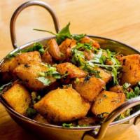 Jeera Chilli Aloo · Potatoes tossed with cumin, green chilies and a blend of Indian spices