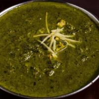 Saag Paneer · Creamy pureed spinach with Indian cottage cheese and garden herbs