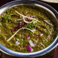 Sarson Da Saag · Pureed mustard greens and spinach, cooked in clarified butter with ginger, garlic, onions, a...