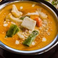 Navaratan Korma · Mixed vegetables and cottage cheese cooked in a creamy sauce with cashews, raisins, and fenu...