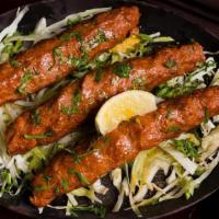 Seekh Kabab · Tandoor style skewered lamb rolls with onions, bell peppers, and a blend of Indian spices (2...