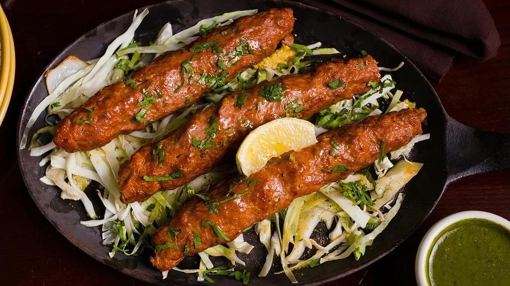 Seekh Kabab · Tandoor style skewered lamb rolls with onions, bell peppers, and a blend of Indian spices (20 minutes preparation time)