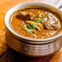 Rogan Josh · Kashmiri style spiced lamb in a yogurt based curry with fresh coriander