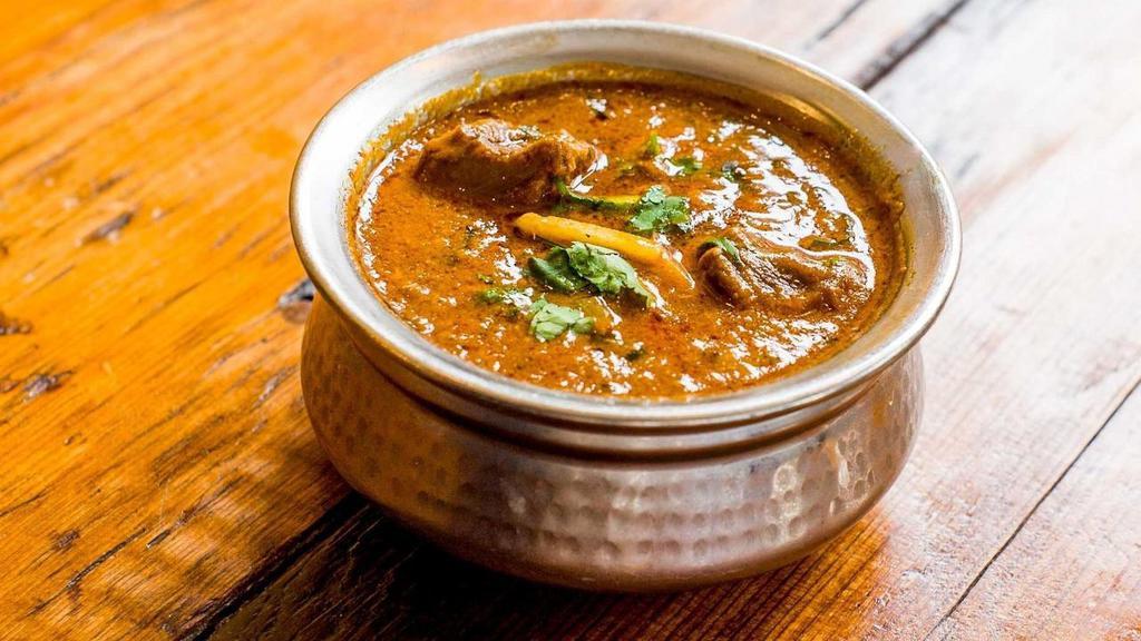 Rogan Josh · Kashmiri style spiced lamb in a yogurt based curry with fresh coriander