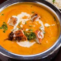Chicken Tikka Masala · Tandoor cooked chicken tikka cooked in a creamy tomato sauce with fenugreek and butter