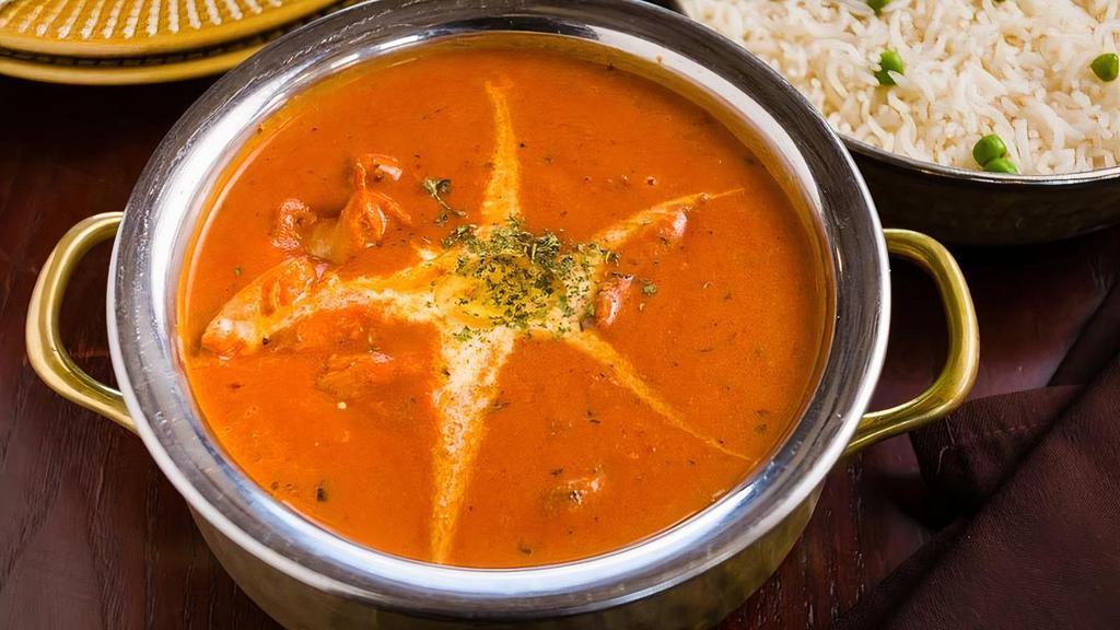 Malai Marke Butter Chicken · Chicken cooked in a creamy onion and tomato sauce with bell peppers and clarified butter
