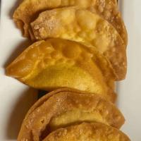Crispy Fried Wonton (7 Pieces) · Crispy fried wontons stuffed with minced chicken. Served with sweet chilli sauce.