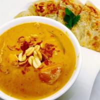 Roti With Massaman · Roti bread with potato-onion-peanuts in massaman curry sauce top with fried onion.